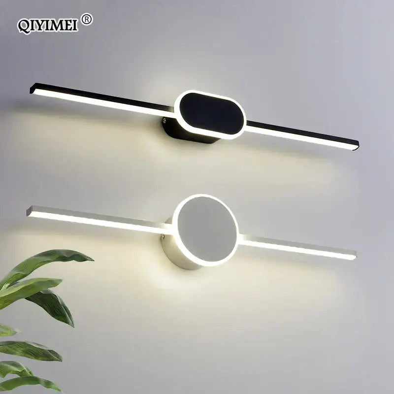 Modern white and black circular led wall lamps with elongated rectangular bars and oval illuminated fixtures for bathrooms