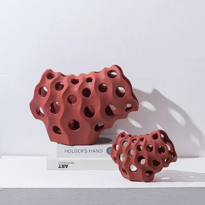 Modern white and black coral geometric resin sculpture featuring a red terracotta ceramic honeycomb design for living room decor