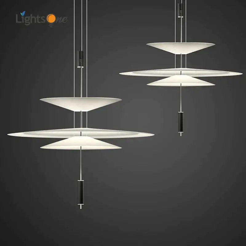 Modern white and black flying saucer pendant light with sleek black cylindrical accents for dining room decorbites pendant light
