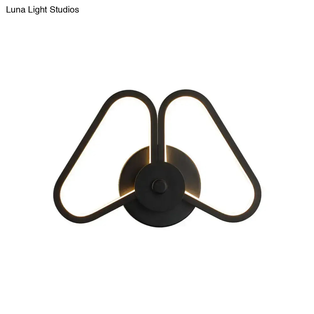Modern white black led triangle wall sconce with two illuminated black metal triangular arms for living room lighting