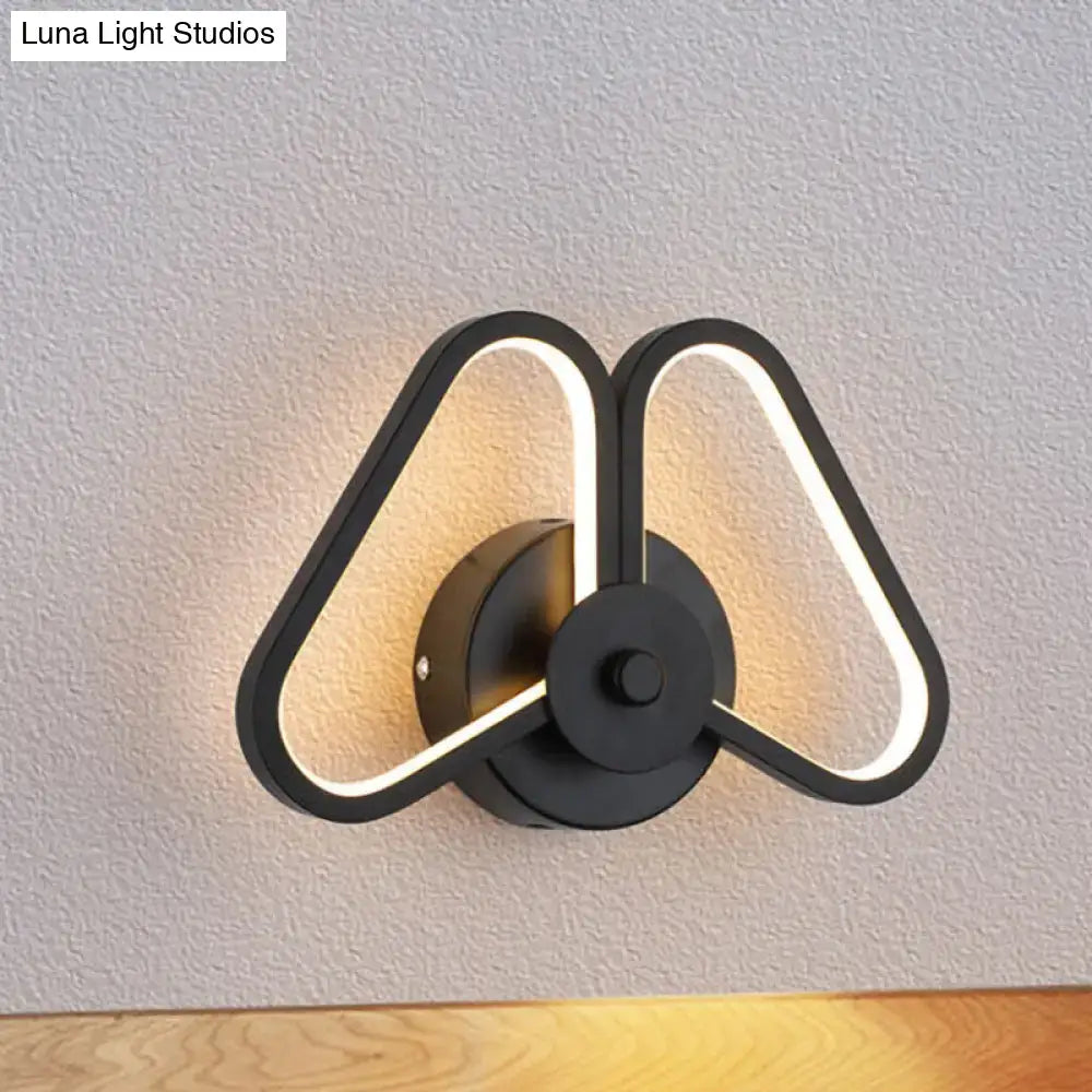 Modern white black led triangle wall sconce with two illuminated triangular arms for living room lighting