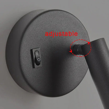 Modern white and black led wall lamp with black matte adjustable arm and circular base for bedroom reading light