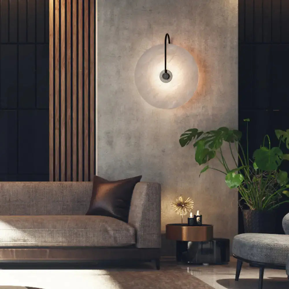 Modern white and black led wall sconce with frosted disc shade glass globe and black metal arm fixture width ideal for bedroom