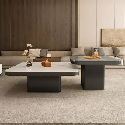 Modern white and black luxury rock square coffee table with a sleek white marble top and dark gray base for living room