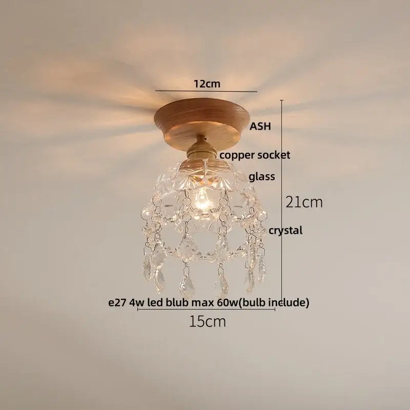 Delicate crystal chandelier with warm wood base and copper socket as a ceramic led ceiling lamp for modern bedrooms