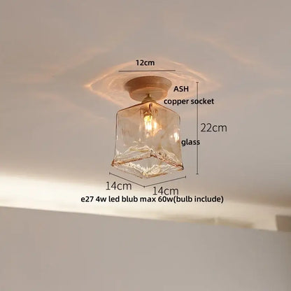A warm-toned hand-blown glass ceiling lamp with copper socket and led bulb for modern ceramic led ceiling lighting