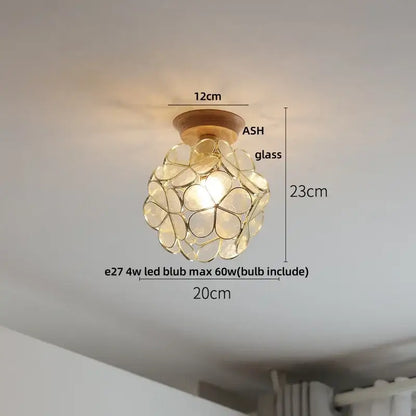 Delicate spherical glass pendant with warm glow and ash wood base for modern white ceramic led ceiling lamp use