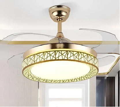 Modern white ceiling fan with curved blades and gold-toned fan lights featuring a geometric lattice design