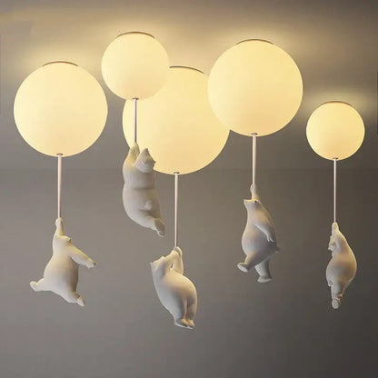 Modern white ceramic bear led ceiling light featuring polar bear figurines with frosted glass globe lights for kids bedroom
