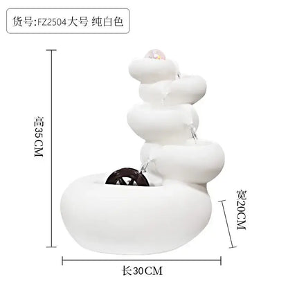 A modern white ceramic circulating water fountain with smooth stacked tiers and dark wooden wheel base for decorbites decor
