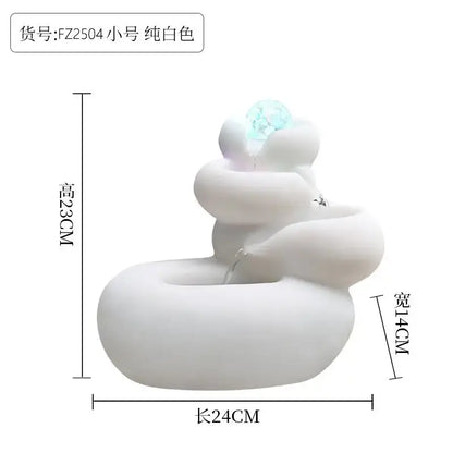 Modern white ceramic circulating water fountain with sculpted resin design and glowing blue crystal decorbites circulating water