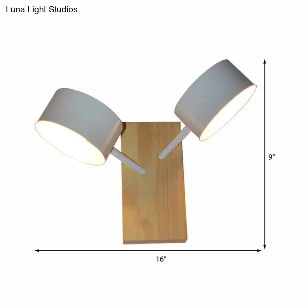 Modern white ceramic double drum wall sconce with matte white shades and natural wood base for 110v-120v use