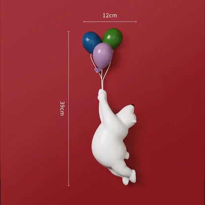 Modern white ceramic bear figurines featuring a flying polar bear holding three colorful balloons for kids bedroom decor
