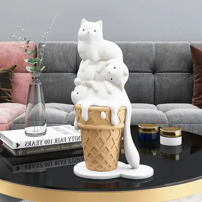 Modern white ceramic ice cream cat sculpture featuring three stacked cats inside a waffle cone with melting ice cream