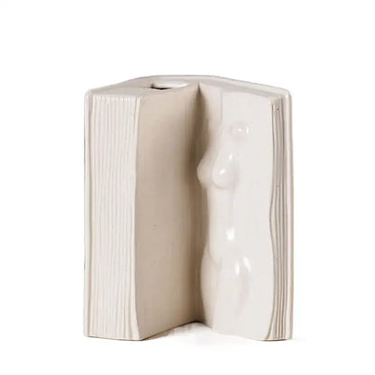 Modern white ceramic man face book vase with cream-colored open book shape and sculpted female figure for living room decorbites ceramic man face decor
