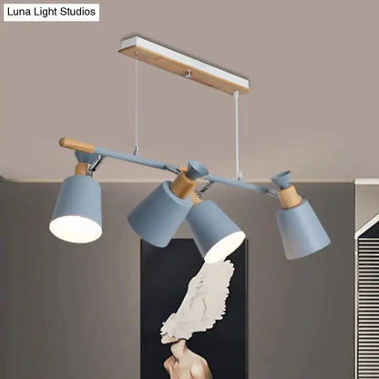 Modern blue and wood-toned island light with tapered shade and adjustable spotlight heads featuring bulb base design
