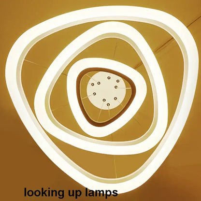 Modern white circle rings acrylic pendant lights featuring concentric triangular rings and central circular LED fixture