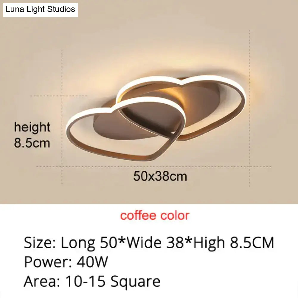 Coffee-colored led wall sconce with modern intertwined heart design complements white coffee pendant lights for bedrooms