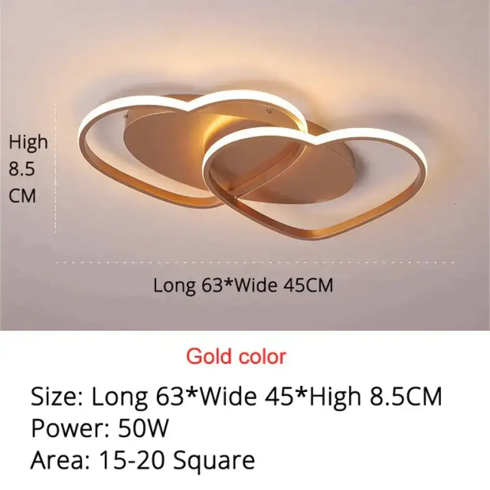 Gold-colored led pendant light with two interlocking hearts and modern minimalist design for white coffee bedroom decor