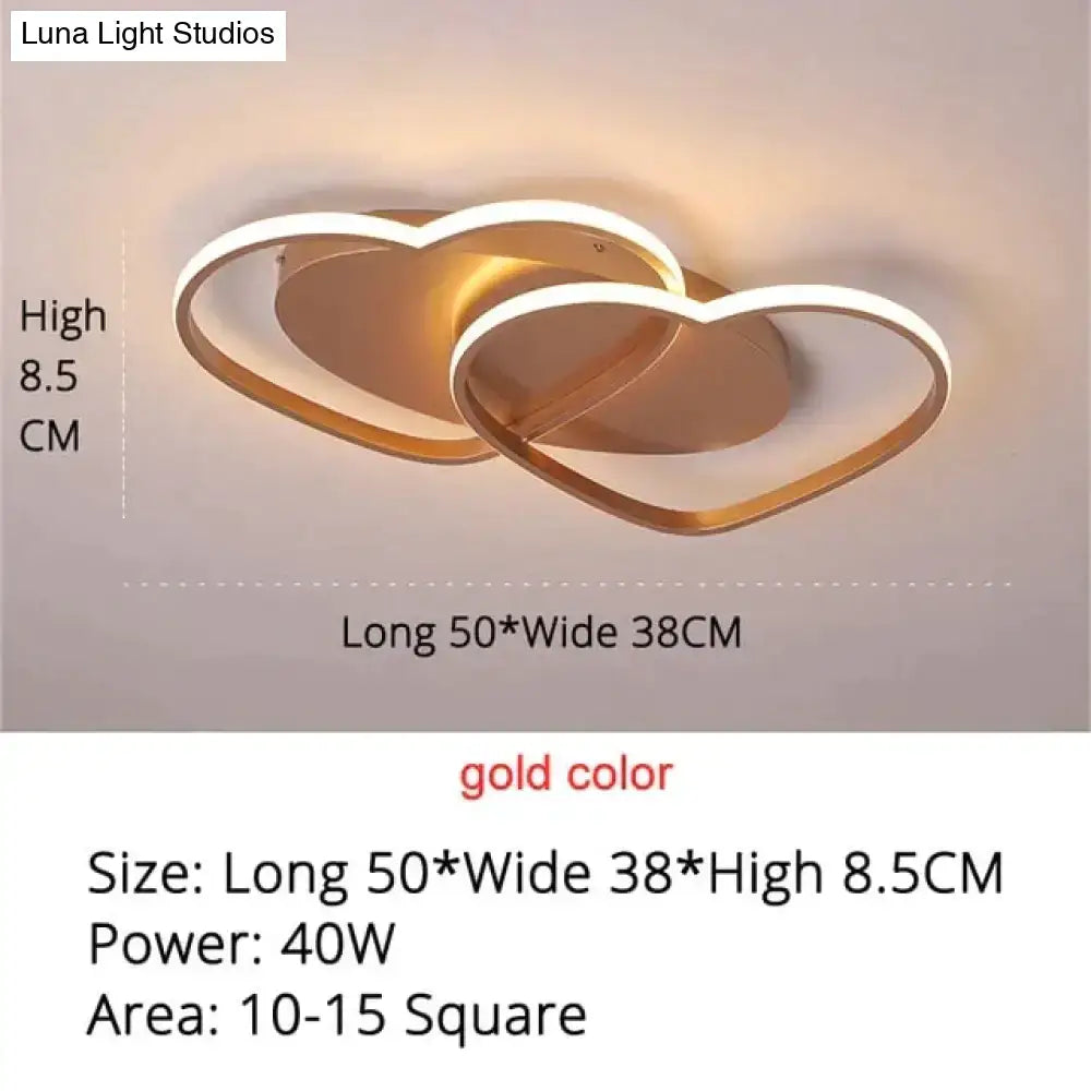 Gold-colored led pendant light with two interlocking heart shapes for modern white coffee bedroom decor