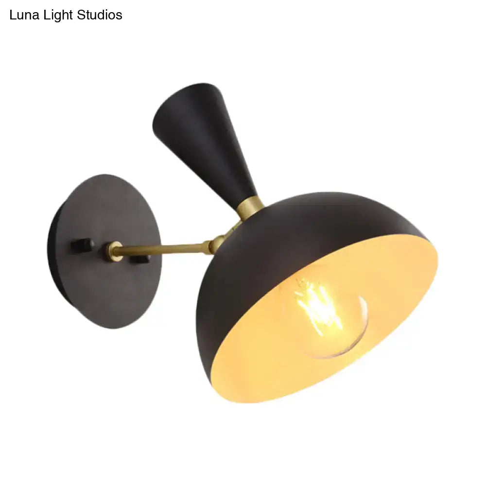 Black matte dome sconce with brass accent and exposed warm bulb featuring rotating node design for 110v-120v use