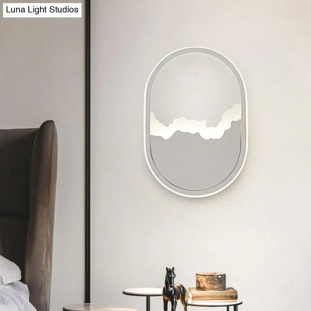 Modern white cracked design oval sconce lamp with sleek frame and illuminated cloud for stairway lighting