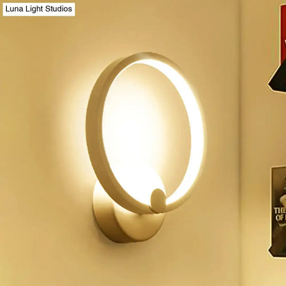 Modern white curved led wall lamp with a warm glowing ring and minimalist metallic finish for bedroom lighting wall lamp light type