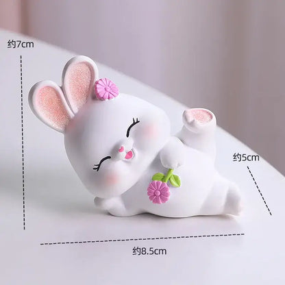 Modern white ceramic cute bunny figurine sculpture with glittery pink ears and flower, ideal for bedroom decor