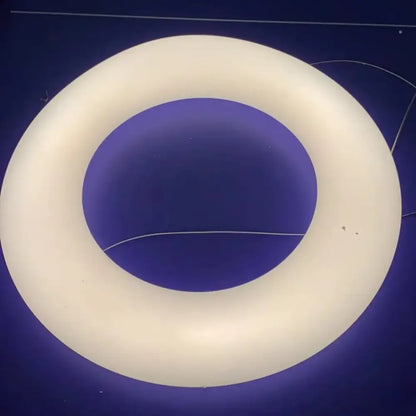 Modern white and dark gray cloud pendant light featuring a cream-colored circular ring light with a smooth matte finish