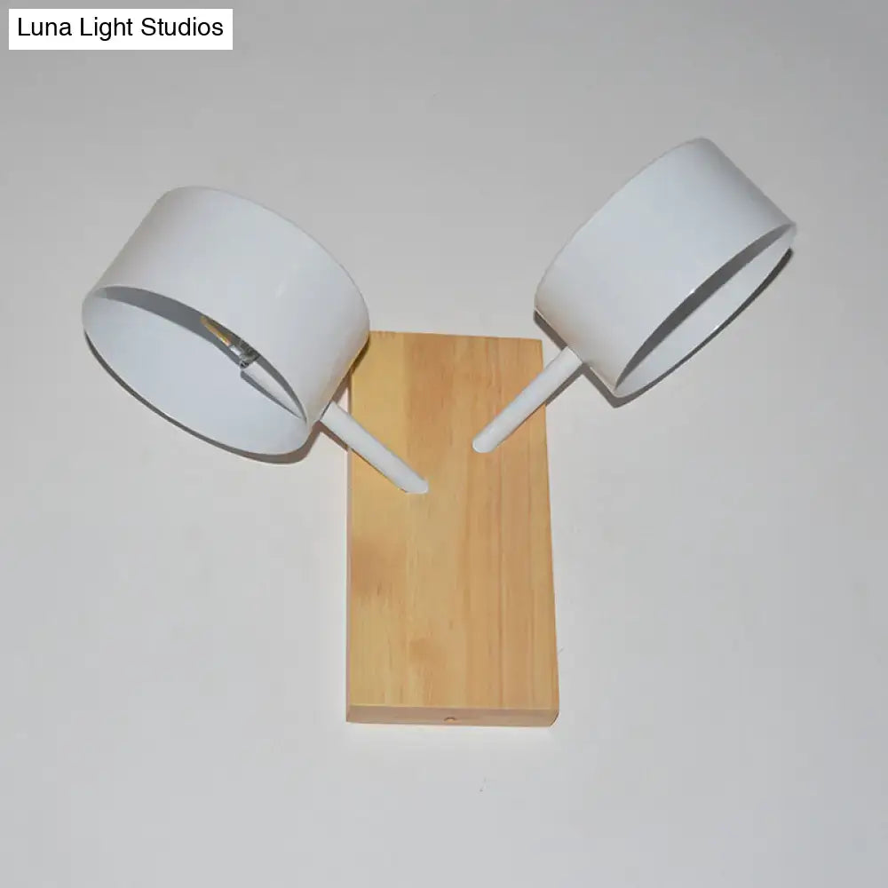 Modern white dual drum wall light with two adjustable arms and natural wood base ideal as a bedroom wall light 220v-240v 110v-120v