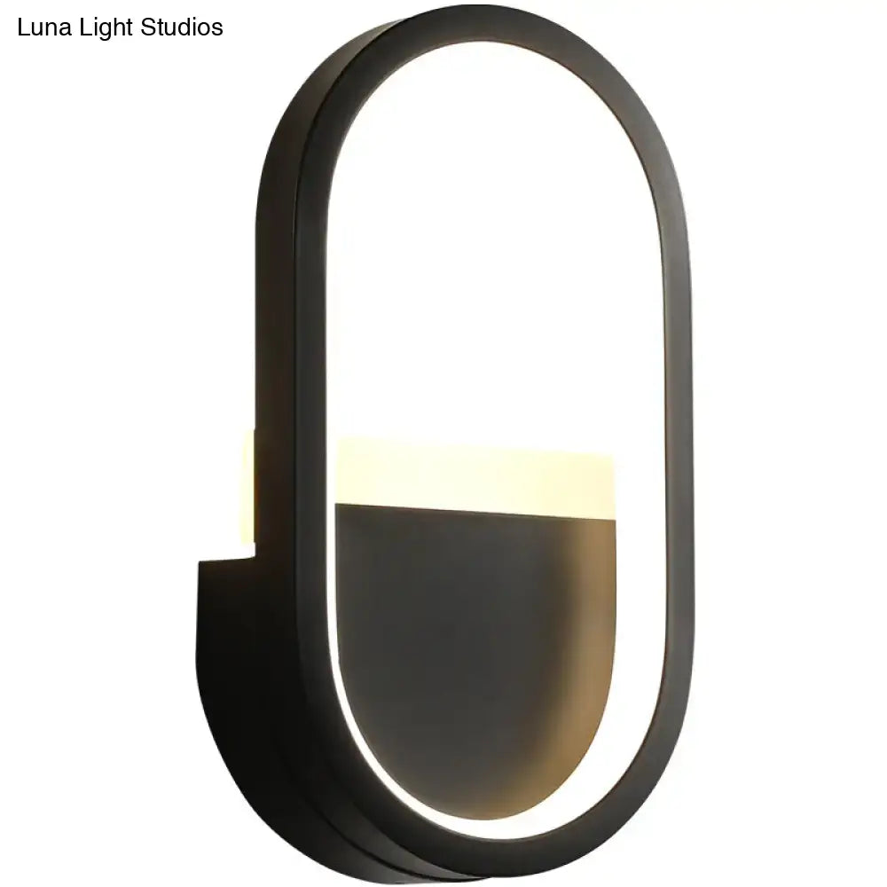 Modern black oval wall lamp with elliptical led wall design and warm lighting for bedroom sconce use