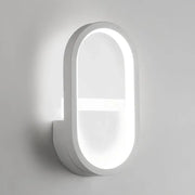 Modern white elliptical led wall lamp featuring a sleek oval design with soft glowing illumination for bedrooms