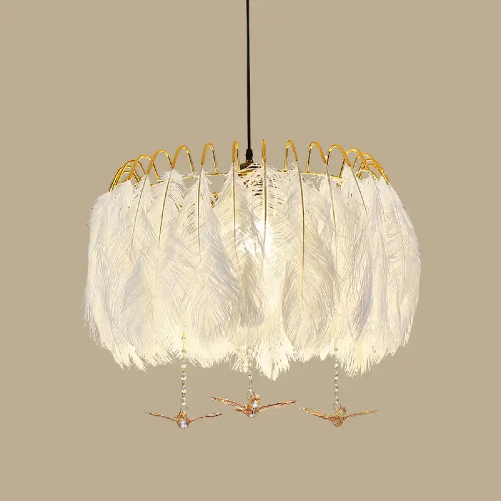 Modern white feather chandelier with gold wire frame and dangling bird ornaments for living room pendant light