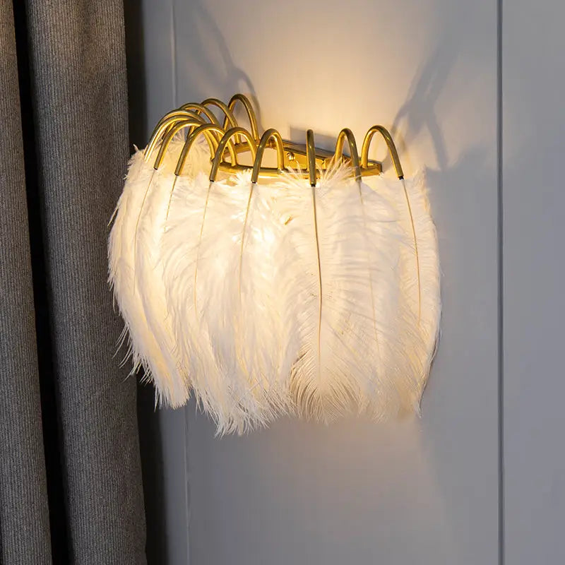 Modern metal wall white feathered wall sconce with gold-toned frame for bedroom lighting