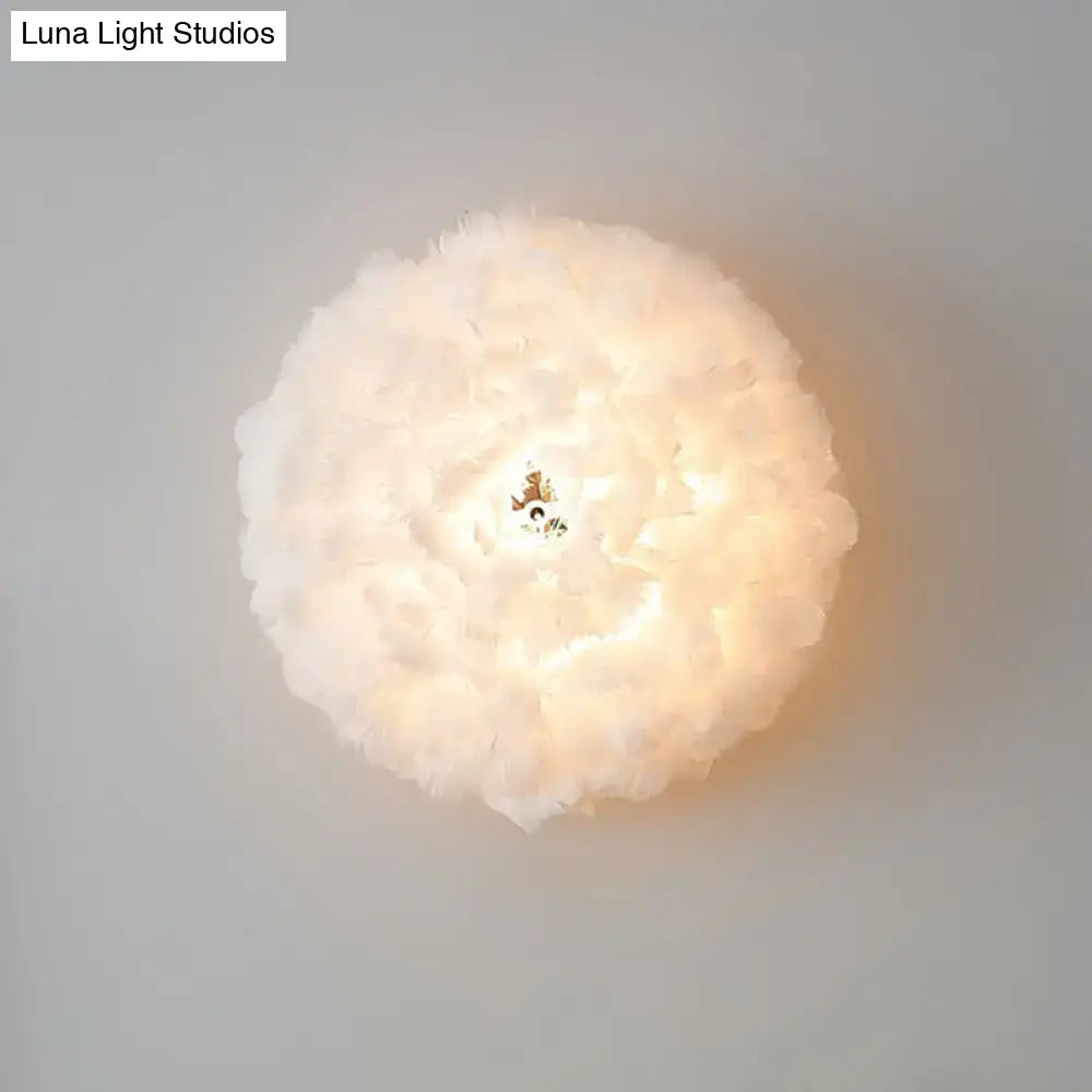 Modern white feather wall sconce with soft layered design and warm glow for bedroom single bulb lighting