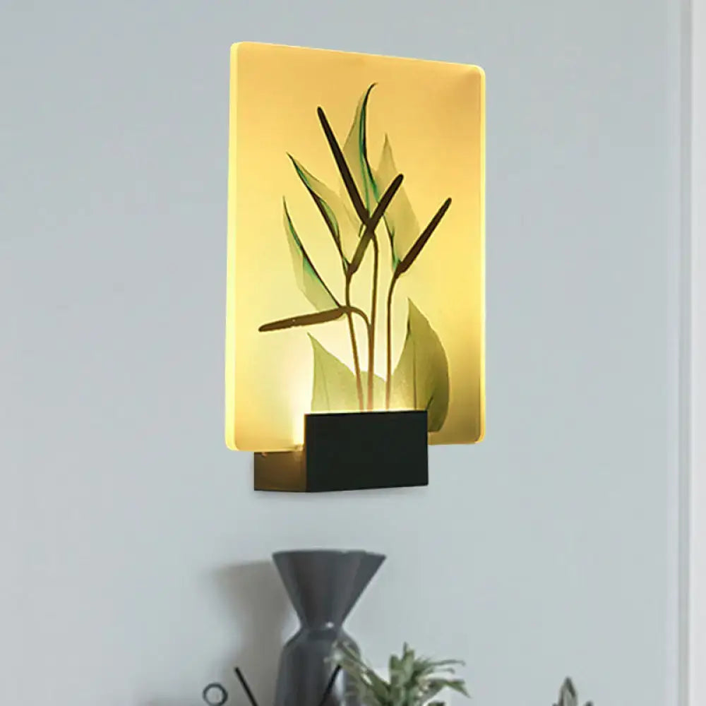 A modern flower bird wall lamp with a warm yellow etched panel on a black base for corner led mural lighting