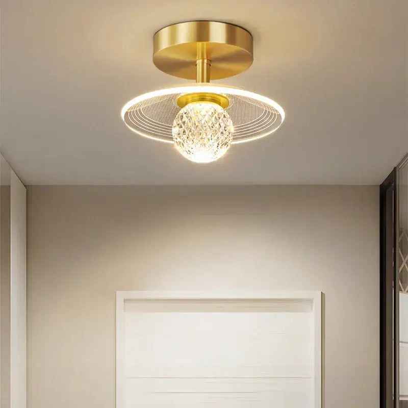 Modern white flower led ceiling lamp featuring a gold-toned crystal globe and circular wireframe halo decorbites led ceiling