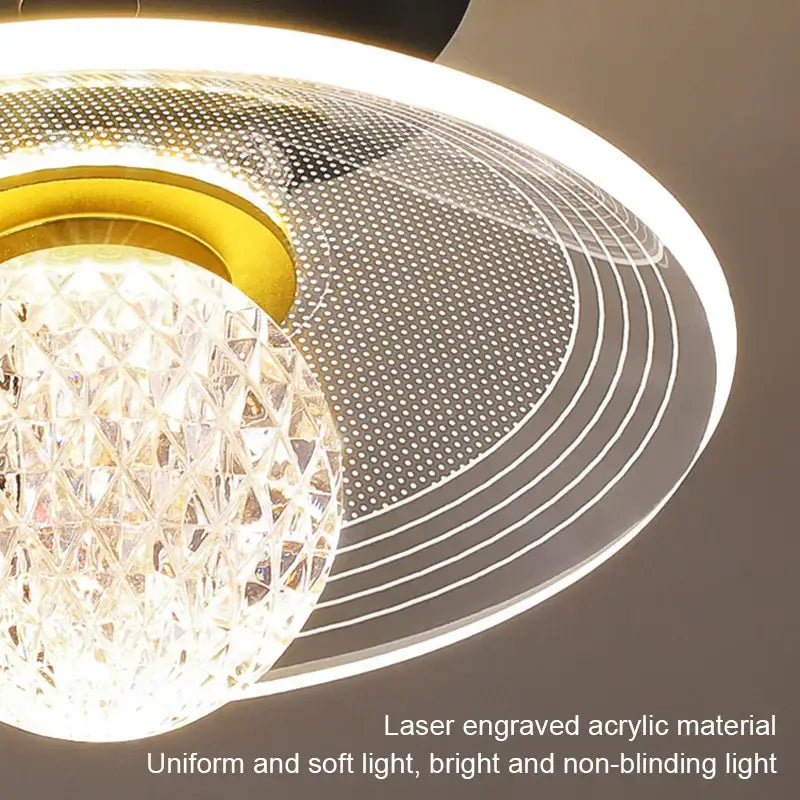 Modern white flower led ceiling lamp featuring a crystal globe and laser-engraved gold and clear acrylic rings decorbites led ceiling