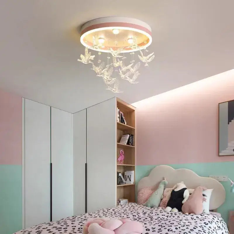 Modern white flying bird ceiling light for kids bedroom with pink and white rim and clear crystal bird ornaments decorbites flying bird