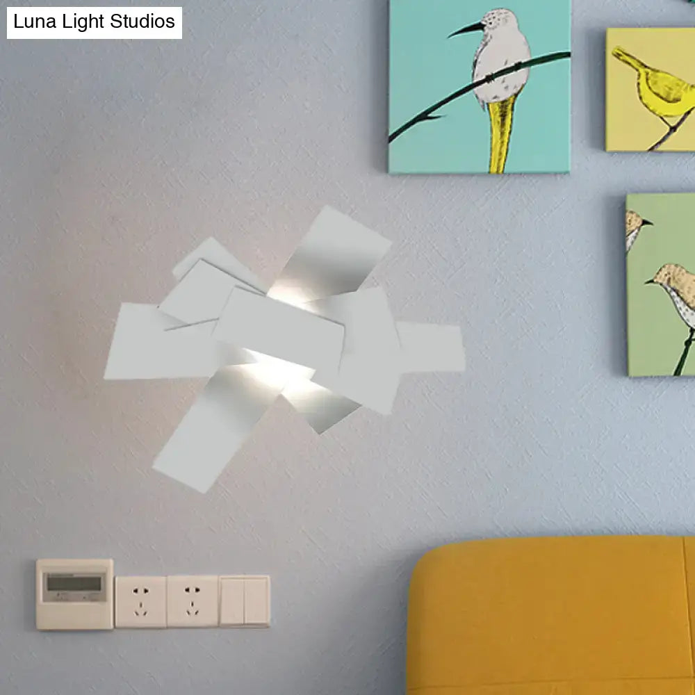 Modern white geometric ceiling light with layered angular panels and 110v-120v bulb base for bedroom use