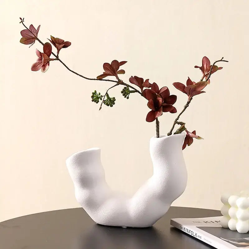 Modern white geometric ceramic flower vase with a unique organic u-shaped design for living room decorbites decor