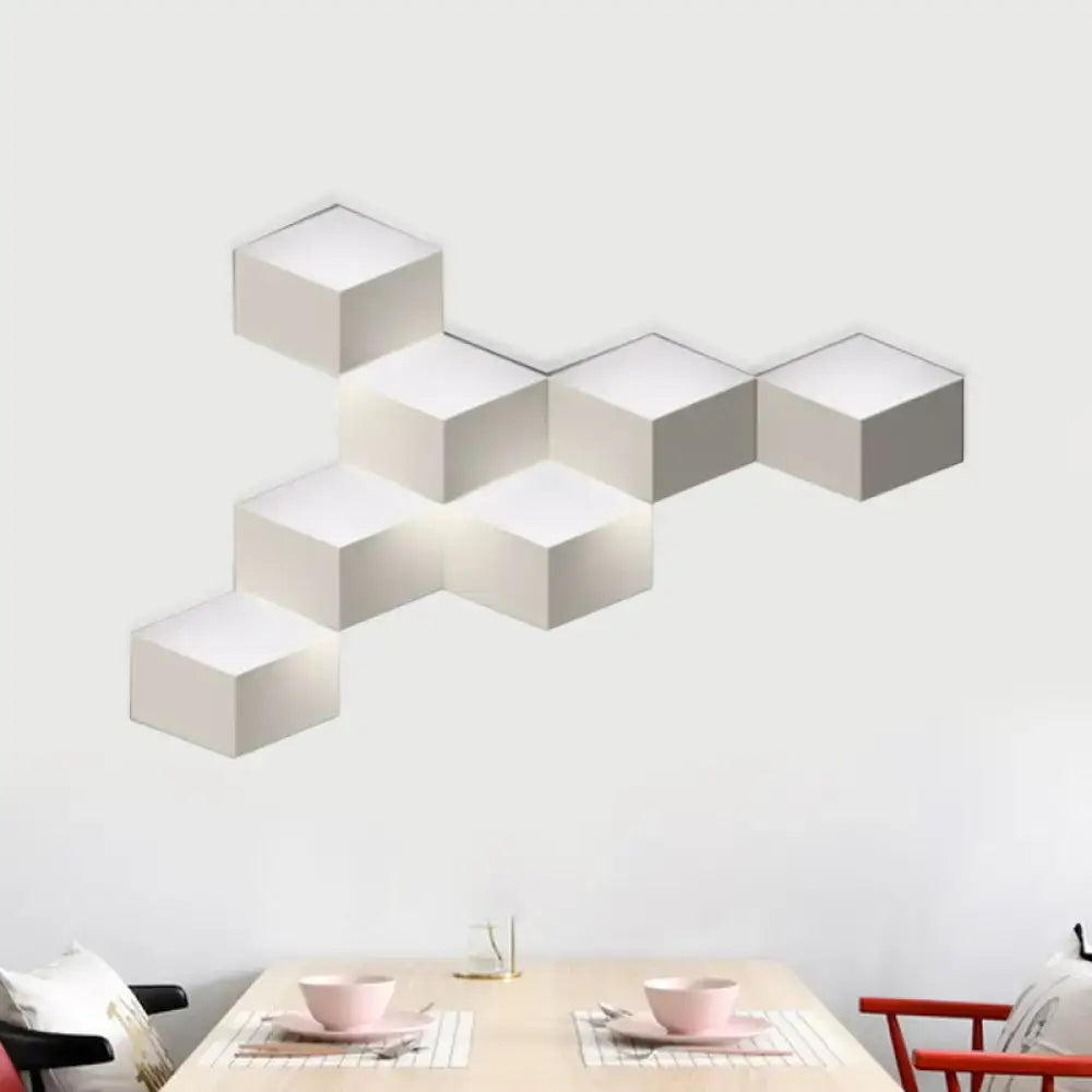 Modern white geometric design wall lamp with a sleek hexagonal light fixture ideal for living room lighting