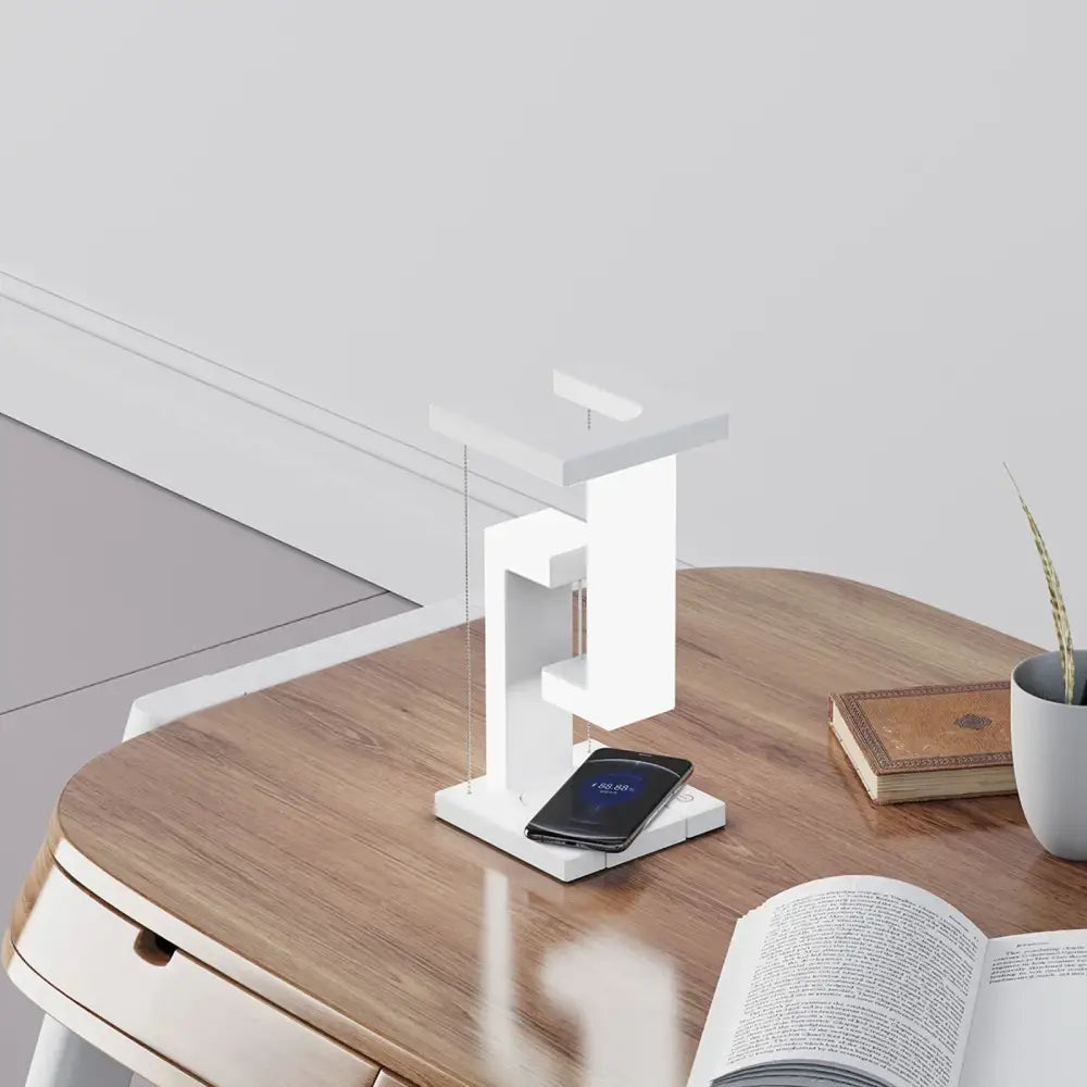 Modern white geometric wireless charger desk lamp with sleek minimalist design and vertical charging slot for bedroom use