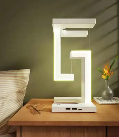 Modern white geometric wireless charger desk lamp with glowing abstract e shaped led light strips for bedroom use
