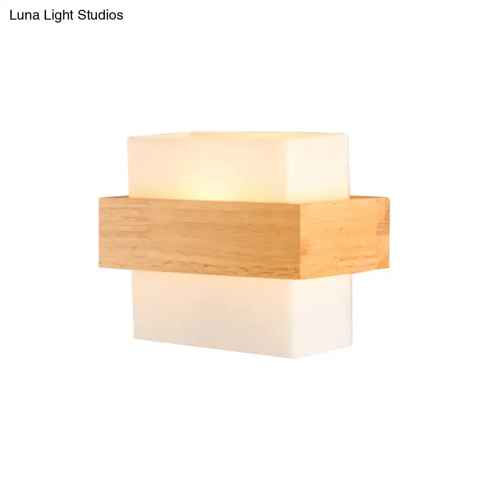 Minimalist modern wall light with warm glow featuring stacked white glass acrylic and light wood elements for bedroom use