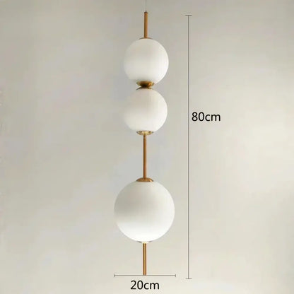 Modern white glass ball led pendant light with frosted spherical shades and polished brass accents for kitchen and dining room decorbites glass ball pendant light