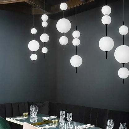 Modern white glass ball led pendant light with black rods perfect for kitchen and dining room decorbites glass ball decor