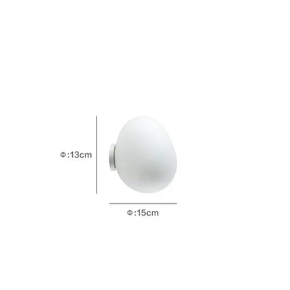 Modern white glass egg wall lamp with frosted globe and metallic base for bedroom featuring elegant egg wall sconces