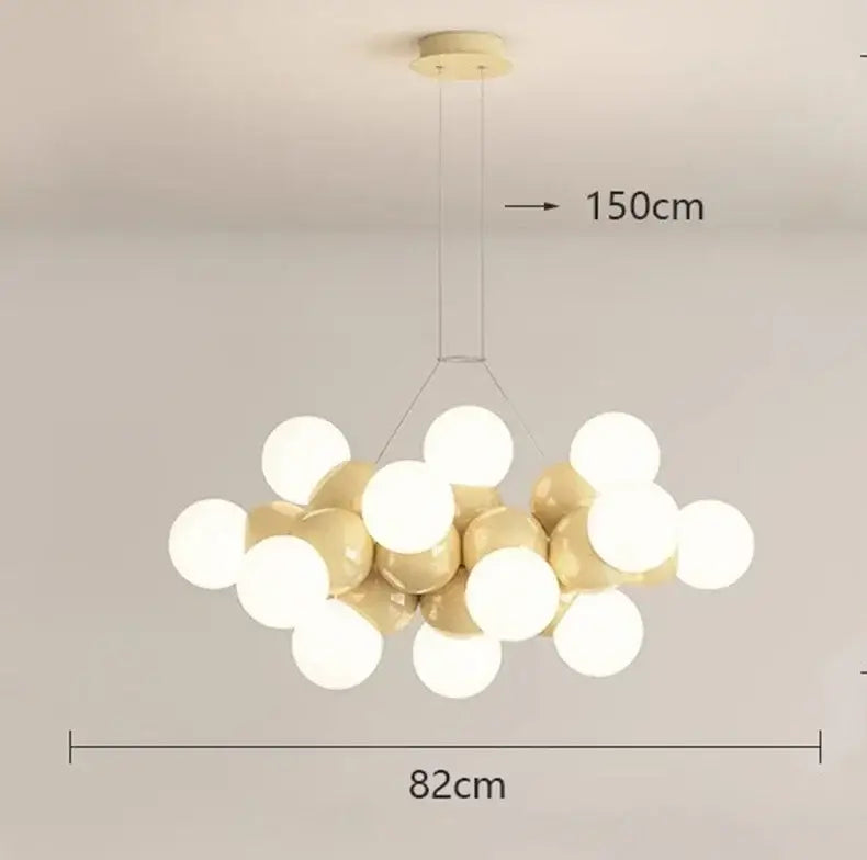 Modern white glass globe pendant light fixture with glossy white and gold spherical bulbs for dining room lighting