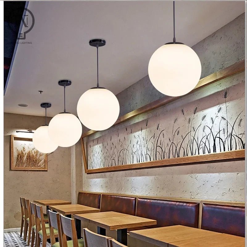 Modern White Globe Glass Pendant Light in Gold, Black, or Silver - Decorbites